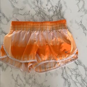 Orange and white nike shorts